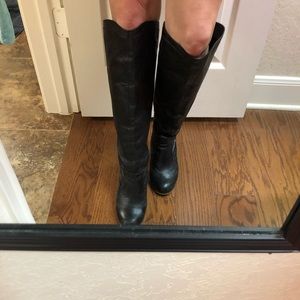 Steve Madden knee high leather boots.
